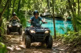 Travelers riding ATVs through the tropical Riviera Maya jungle