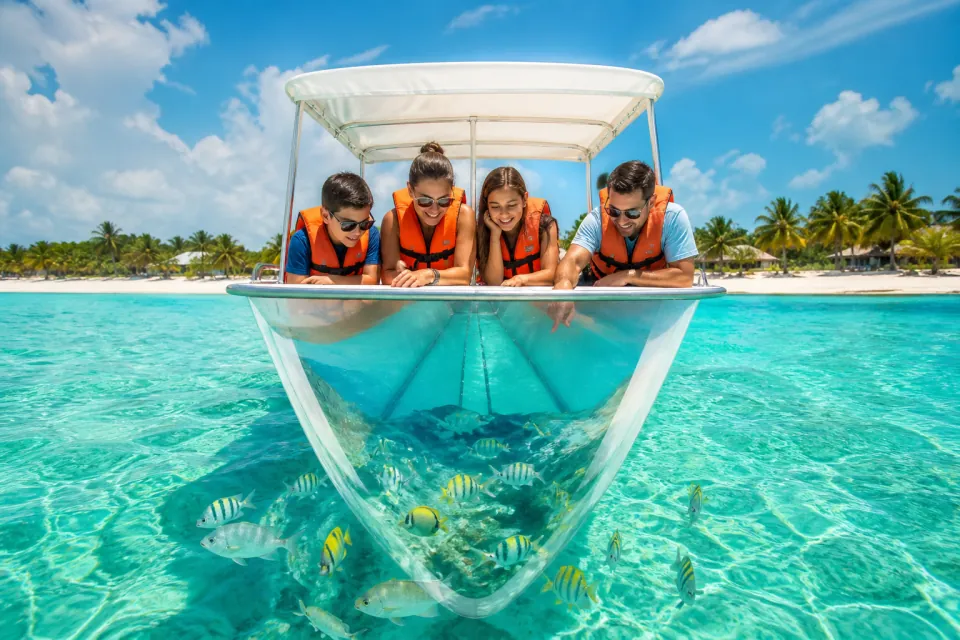 Snorkelers exploring crystal-clear turquoise Caribbean water